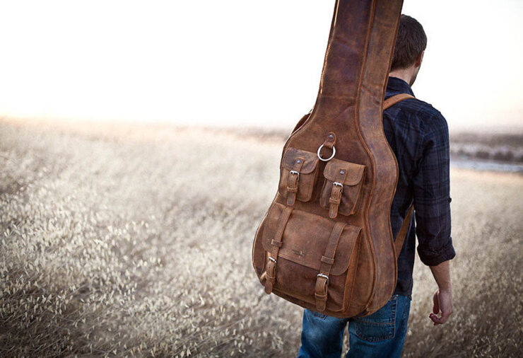 carrying a guitar